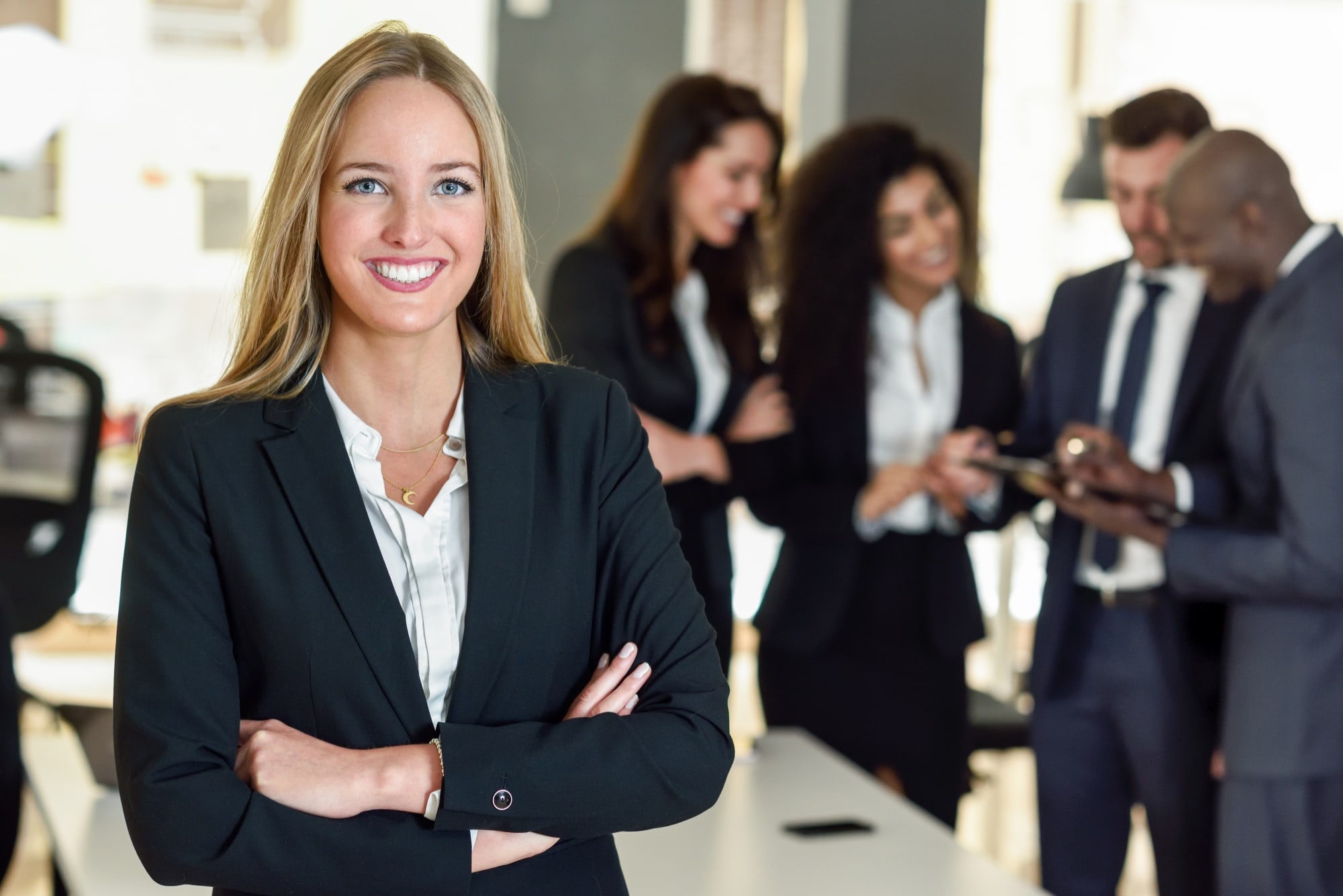 Happy female professional in a suit.